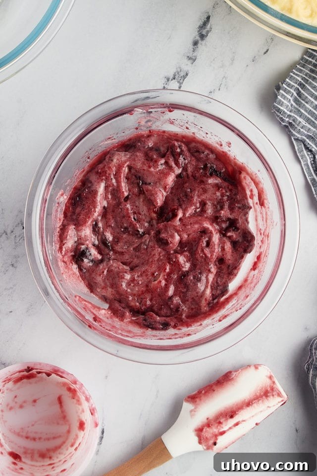 A close-up overhead view of the rich, dark cherry filling, ready to be layered into the coffee cake.