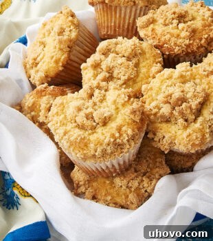Vanilla Crumb Muffins in a towel-lined metal basket