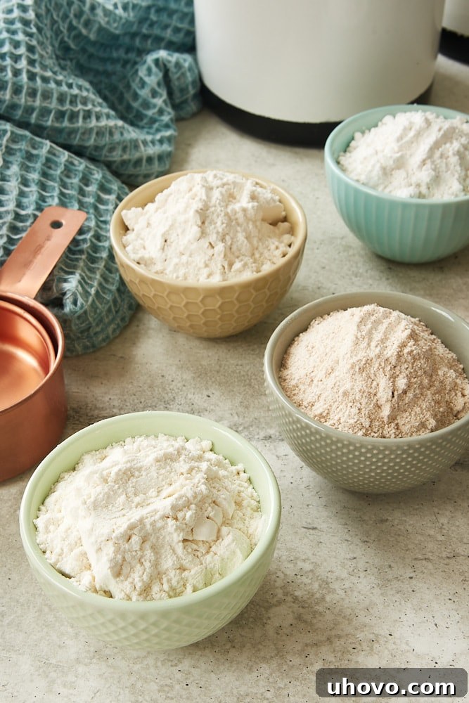 different types of flours in small colorful bowls
