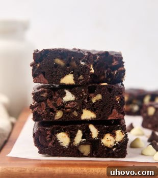 Stack of 3 triple chocolate brownies, perfectly baked and fudgy