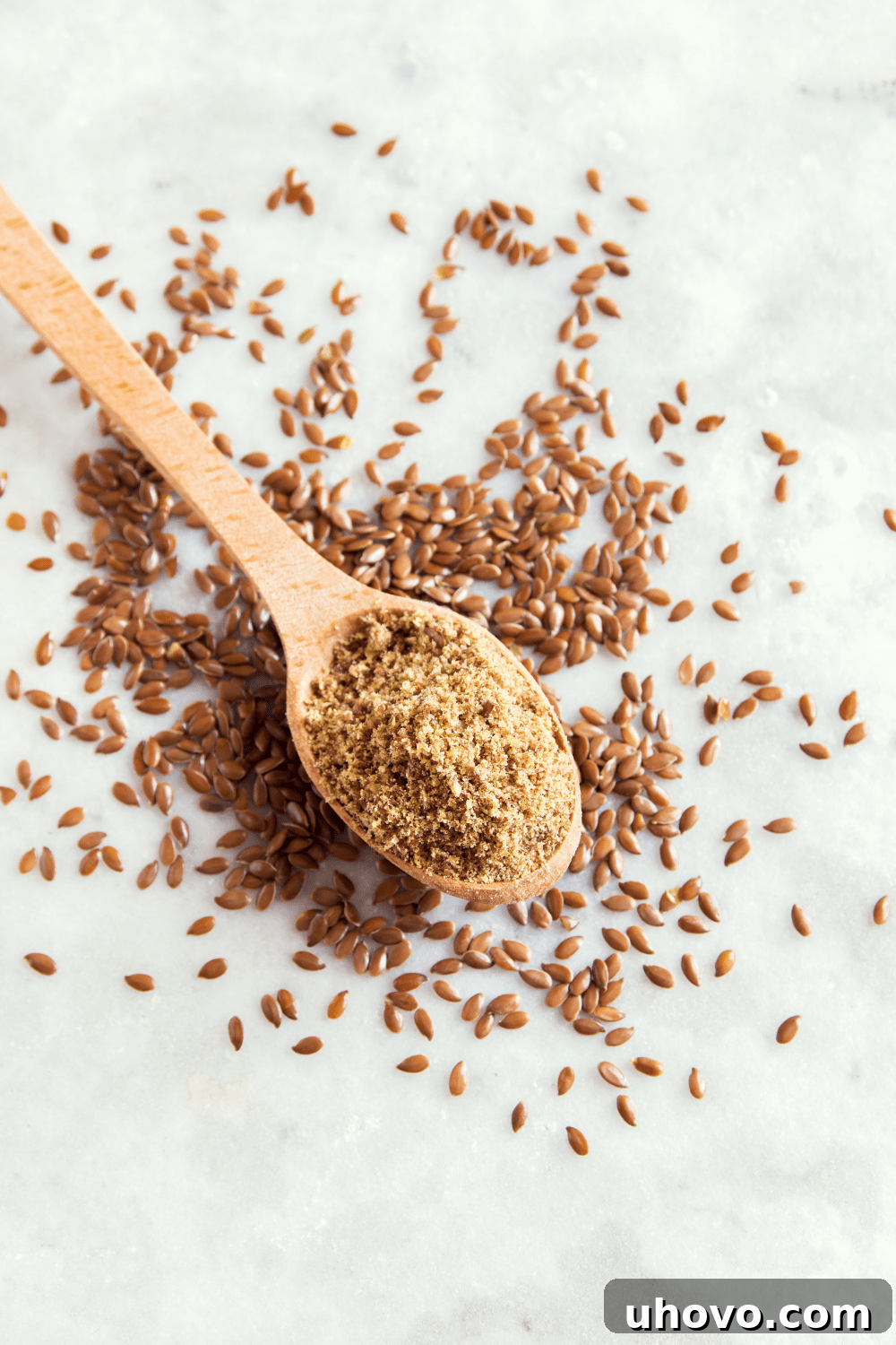 ground flax seeds in a wooden spoon