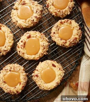 overhead view of Caramel Pecan Thumbprint Cookies on a wire rack