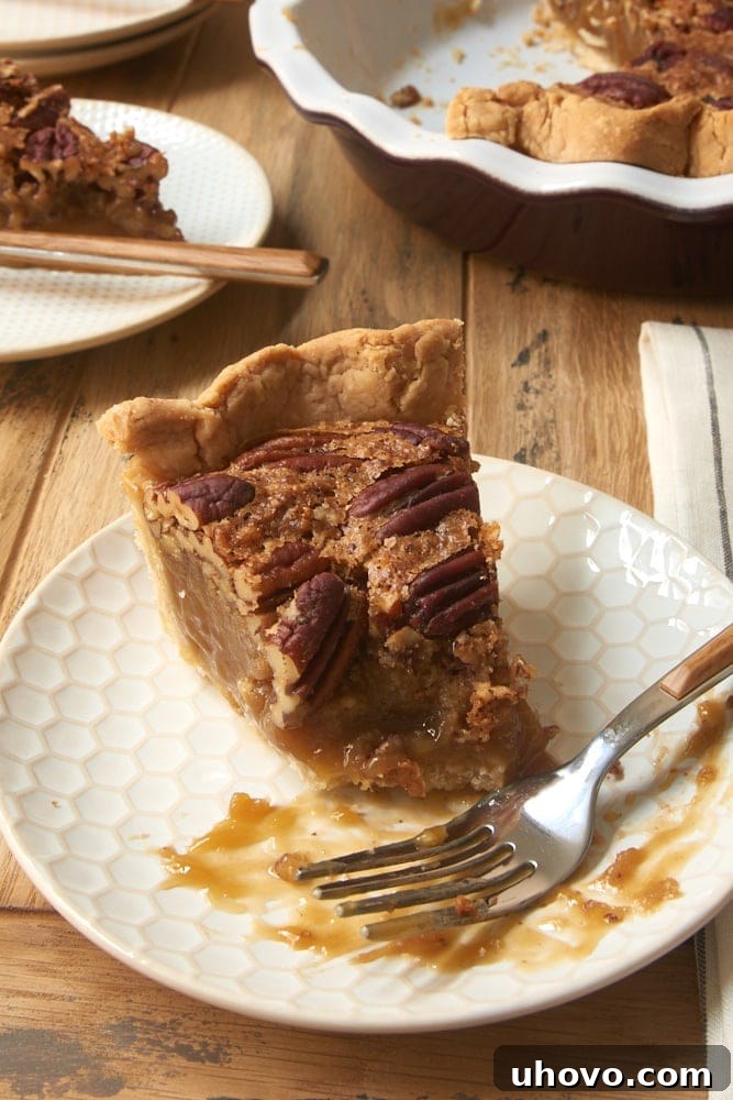 slice of Irish Cream Pecan Pie with a few bites missing