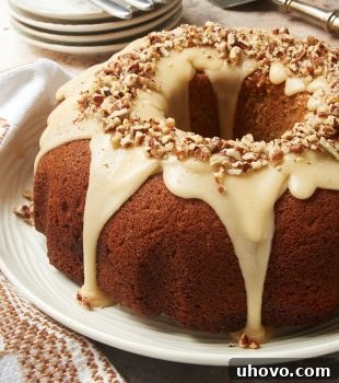 Brown Sugar Spice Cake with Caramel Rum Glaze on a white plate