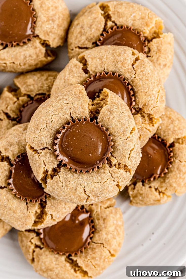 Overhead view of peanut butter cup cookies piled onto plate