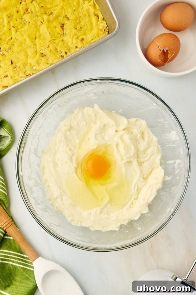 overhead view of egg added to chess squares filling mixture
