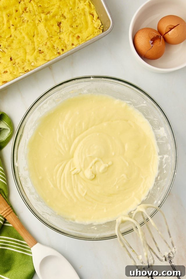 overhead view of mixed chess squares filling mixture in a glass mixing bowl