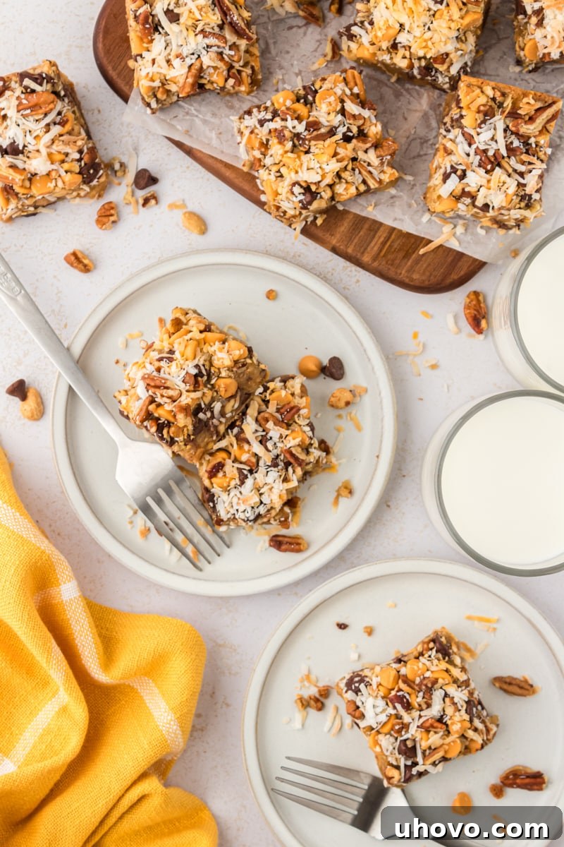 An inviting overhead view of freshly baked toffee squares, neatly arranged on white plates and a rustic wooden cutting board, ready to be enjoyed.