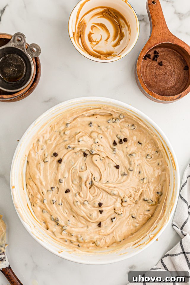 Overhead view of peanut butter chocolate chip pie filling in mixing bowl