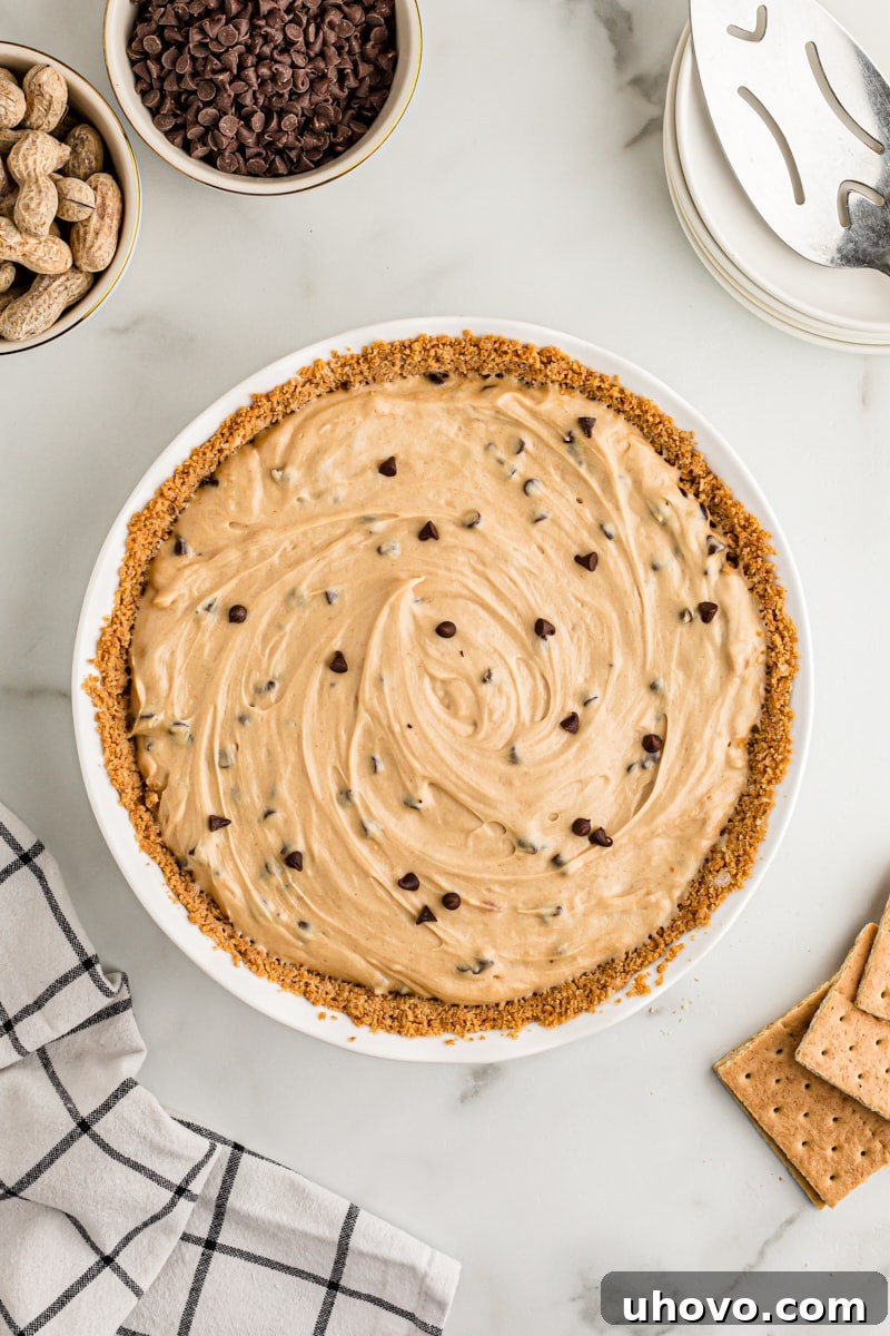 Overhead view of whole peanut butter chocolate chip pie before chilling