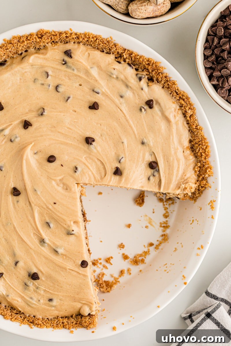 Overhead view of peanut butter chocolate chip pie with two slices removed