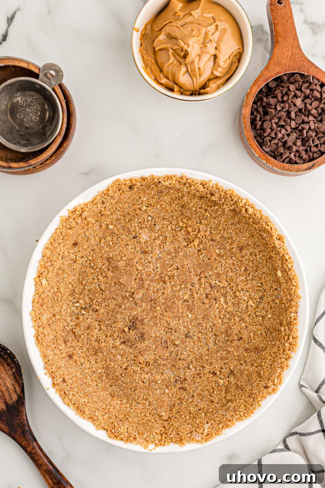 Overhead view of graham cracker crust in pan
