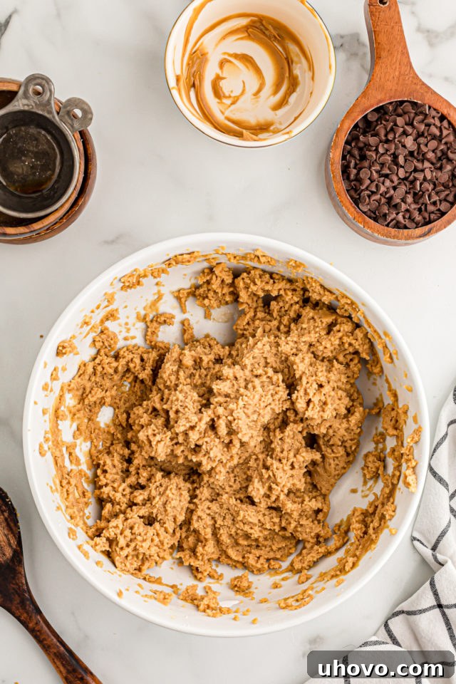 Overhead view of peanut butter cream cheese filling in mixing bowl