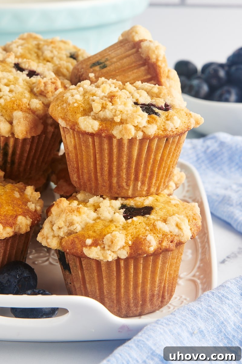 Stack of blueberry crumb muffins on platter