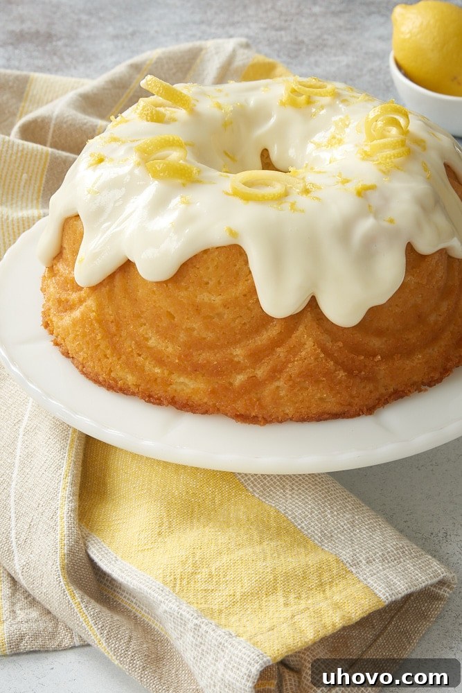 A vibrant Lemon Bundt Cake with a generous drizzle of lemon glaze.
