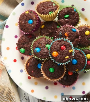 overhead view of M&M Brownie Bites on a multi-colored polka dot plate