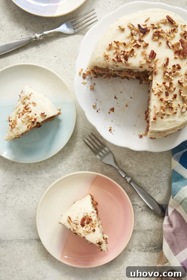 Overhead view of several slices of 6-Inch Hummingbird Cake, each placed on a different colorful plate, invitingly showing off its layers and frosting.