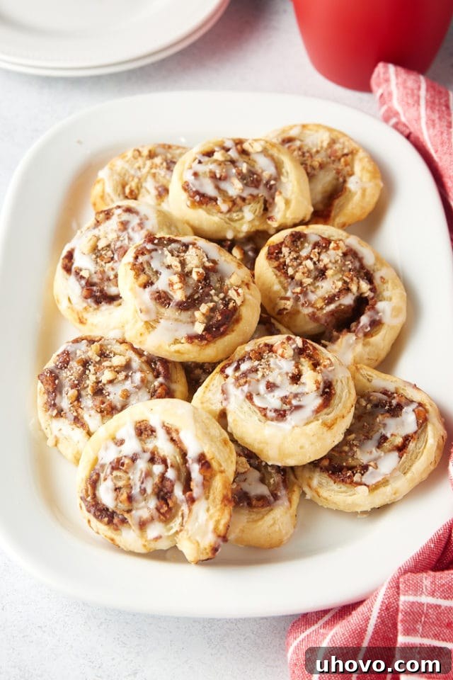 Apple Butter Pinwheels piled on a white serving tray