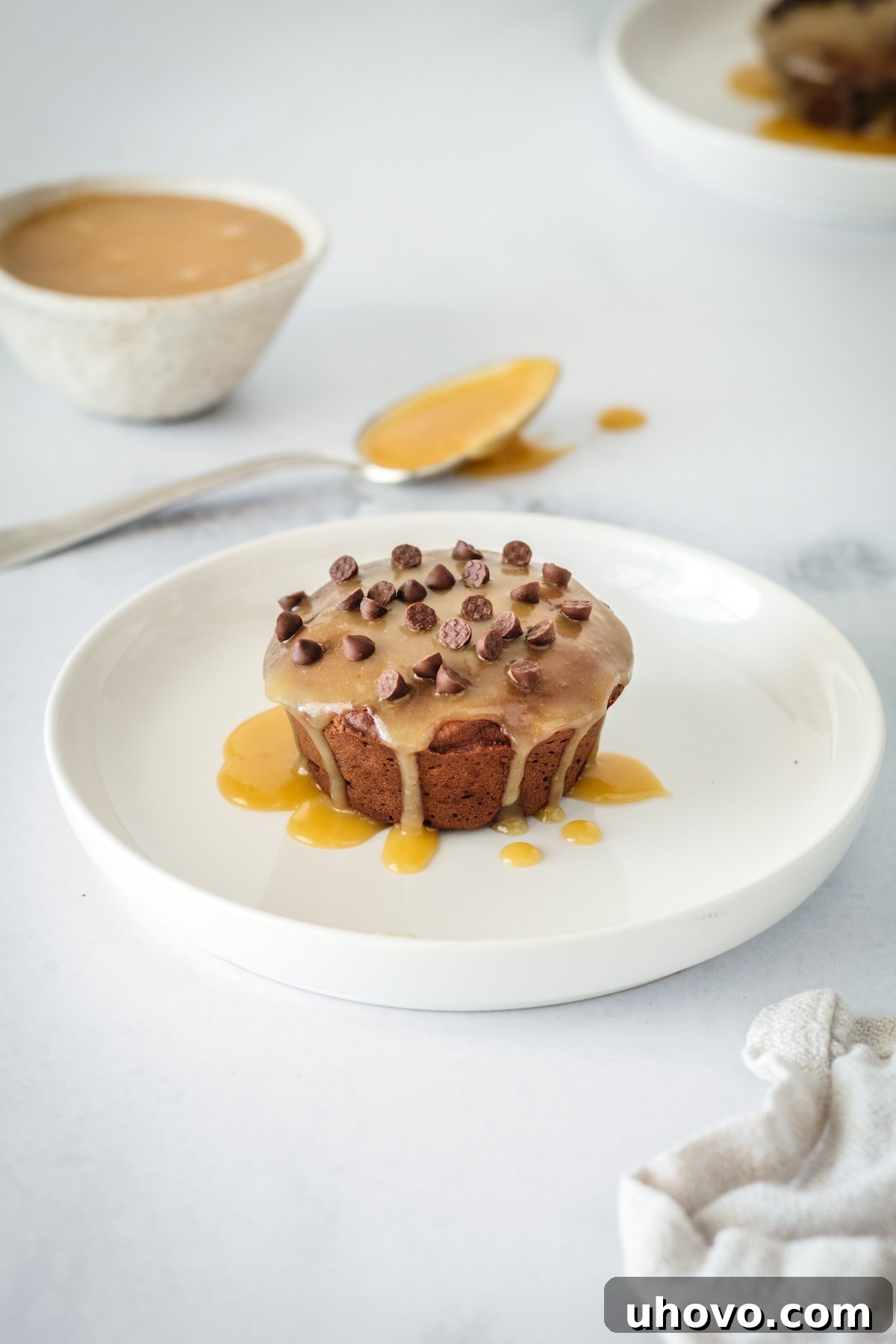Plated mini chocolate pound cake glazed with butterscotch and topped with chocolate chips