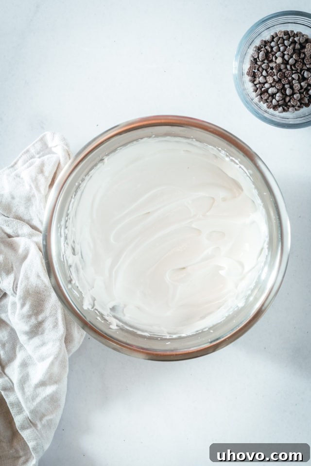 Overhead view of Swiss meringue in mixing bowl