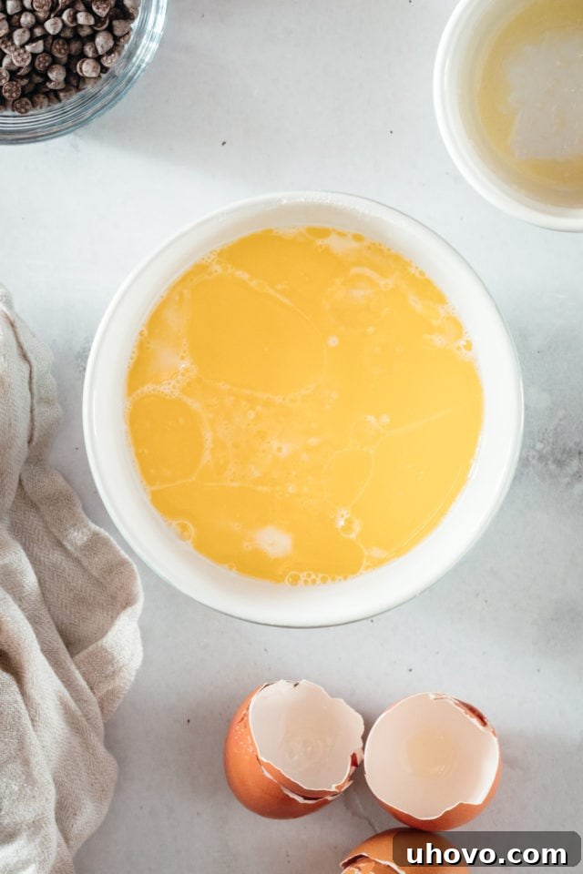 Overhead view of eggs in bowl after whisking