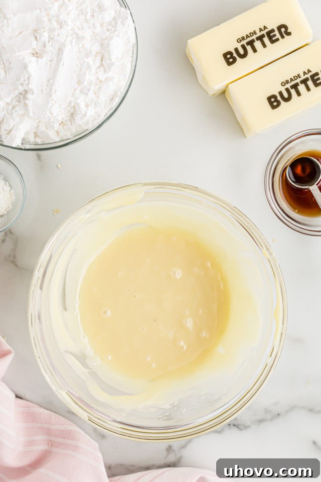 Melted white chocolate in a glass bowl, ready for frosting
