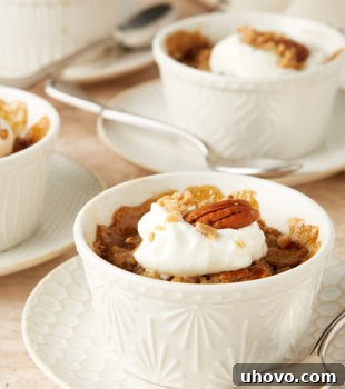 Ginger Pear Pudding Cakes in white ramekins on white and beige plates