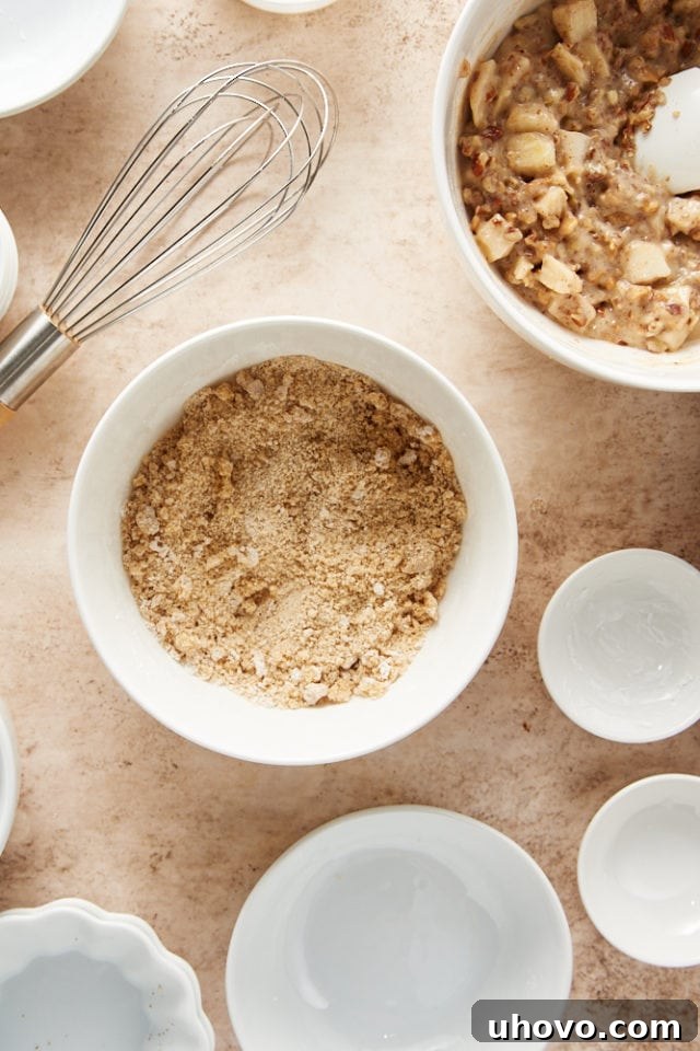 overhead view of brown sugar, cornstarch, and salt mixed in a white mixing bowl