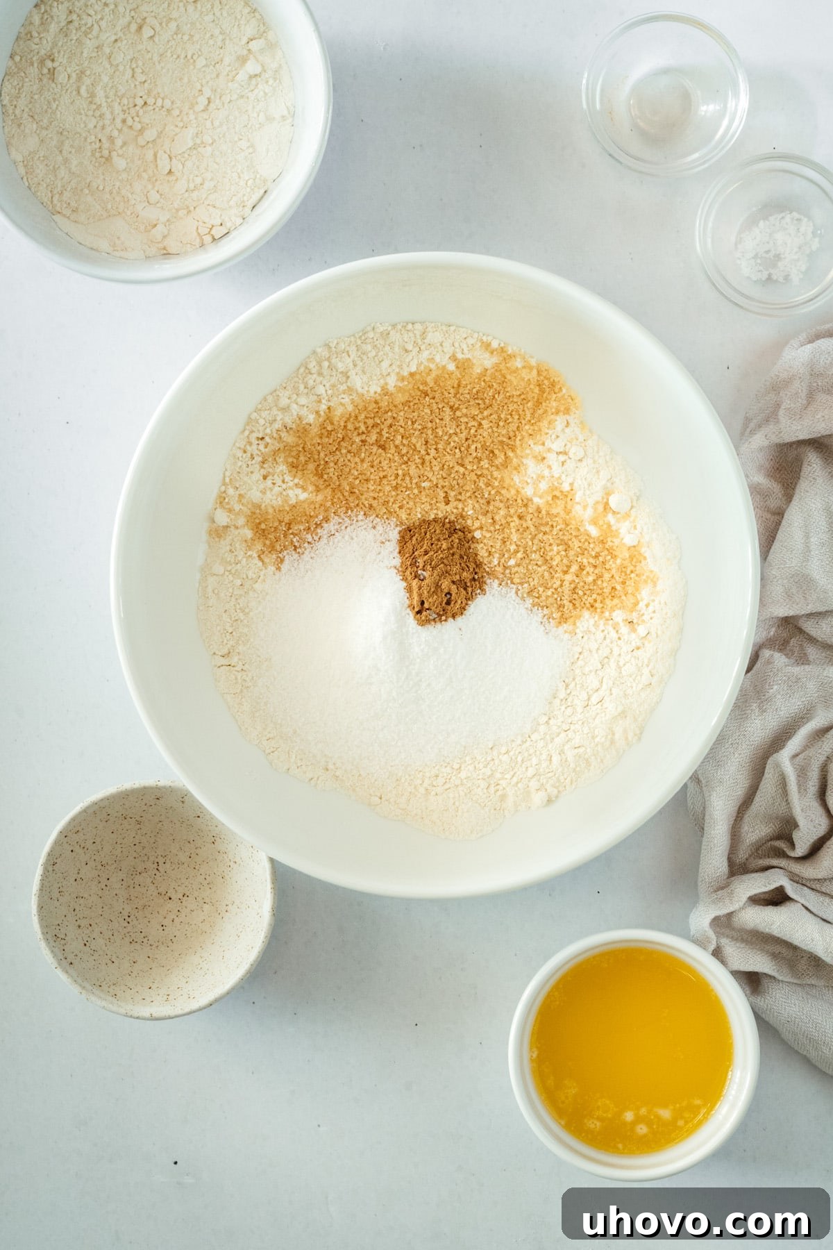 Overhead view of dry crumb topping ingredients in a bowl before butter is added.