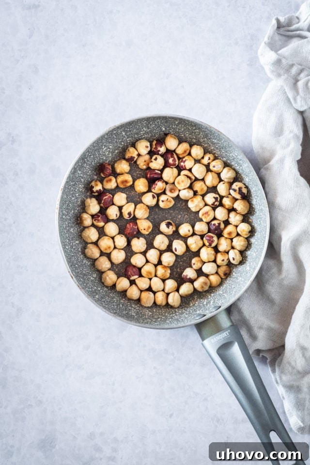 toasting hazelnuts in a skillet
