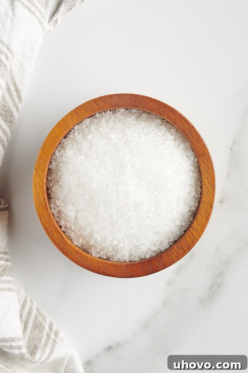 overhead view of sanding sugar in a small wooden bowl