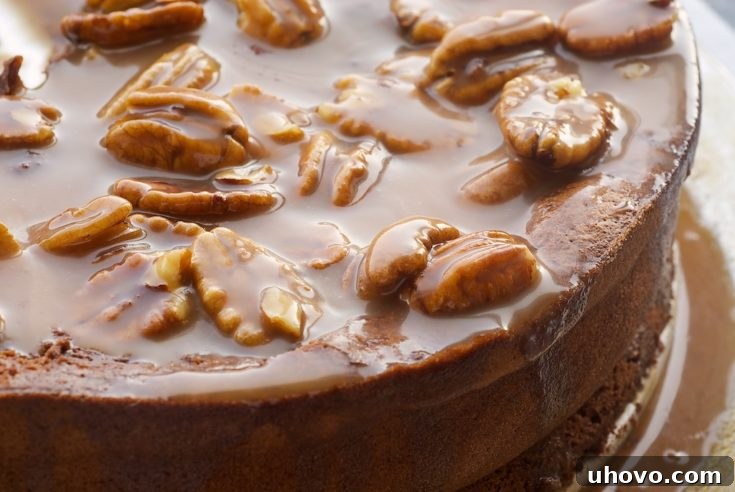 A stunning Chocolate Caramel Pecan Souffle Cake, ready to be served, showcasing its elegant presentation and rich topping.