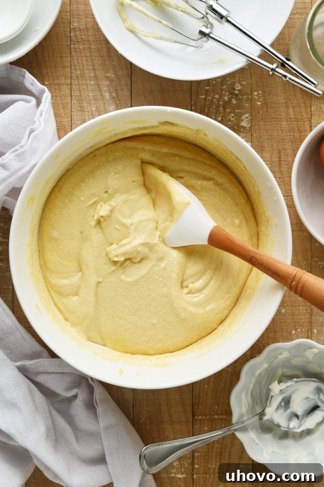 Overhead view of the perfectly mixed cake batter for Almond Crumb Cake in a white mixing bowl.