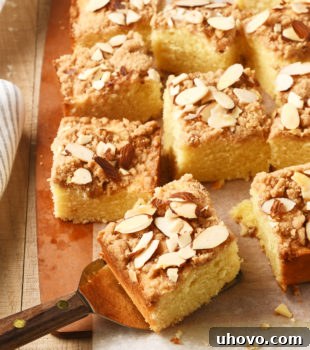 slices of Almond Crumb Cake on a wooden cutting board