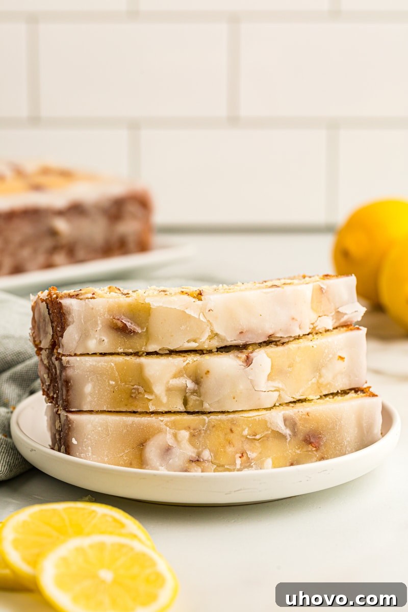 3 slices of lemon bread stacked on plate