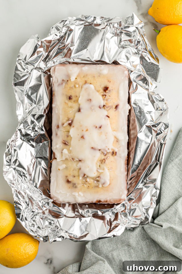 Overhead view of unwrapped lemon bread on piece of foil