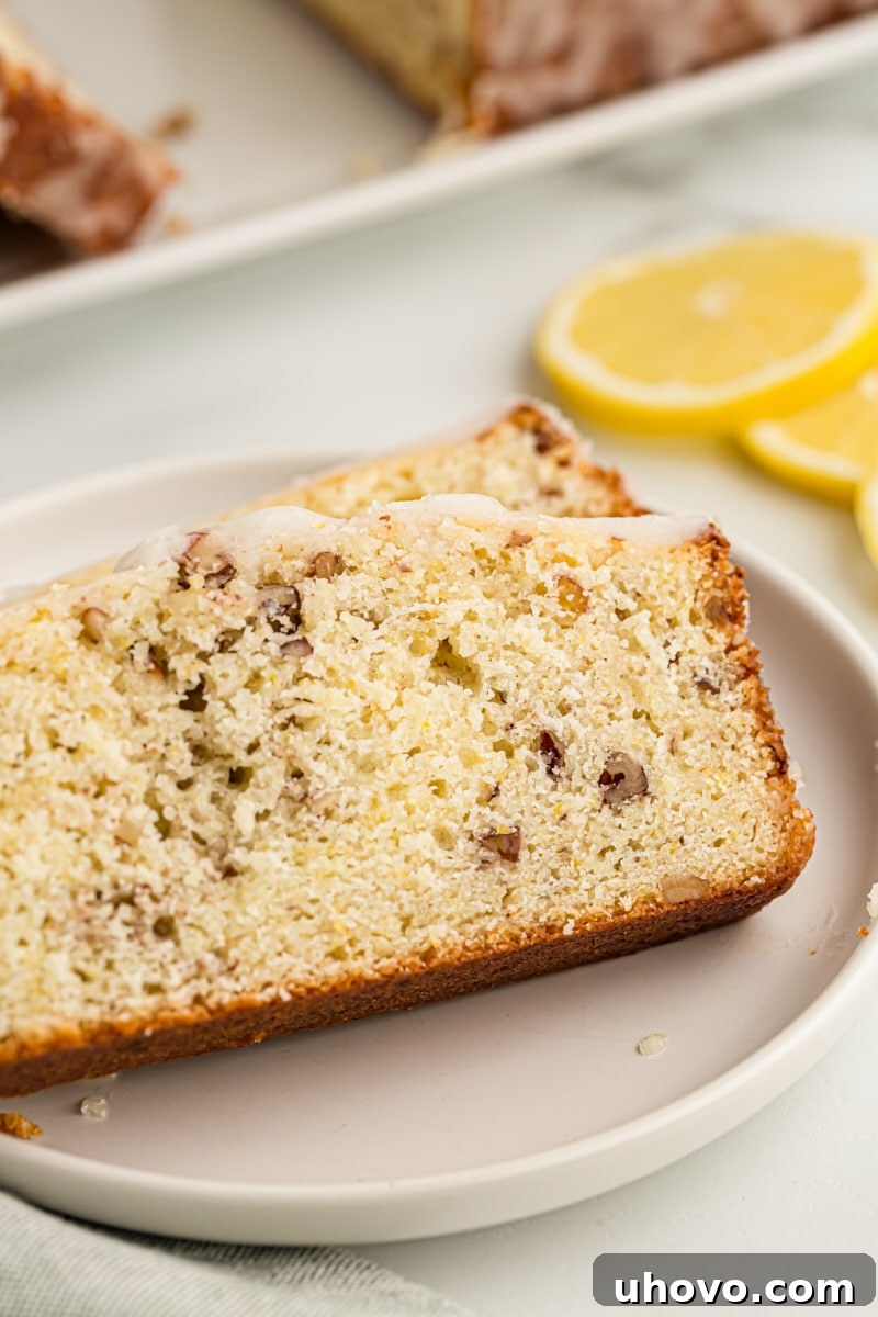 Two slices of lemon bread on white plate
