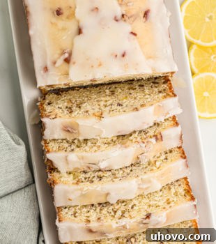 Overhead view of sliced lemon bread on serving tray