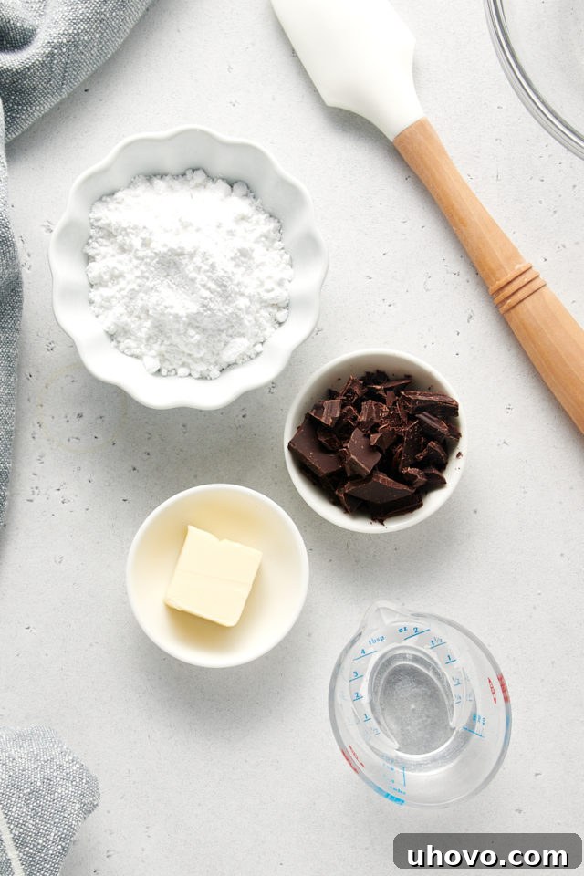 A close-up overhead view of the ingredients specifically for the chocolate glaze, ready to be combined for a smooth, glossy finish on the loaf cake.
