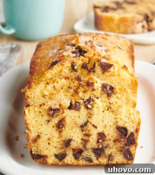 Sliced Chocolate Chip Loaf Cake on a white serving tray