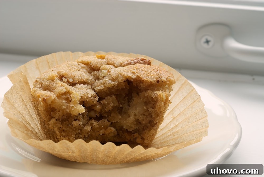Delicious Pear and Pecan Muffin on a white plate, ready to be enjoyed