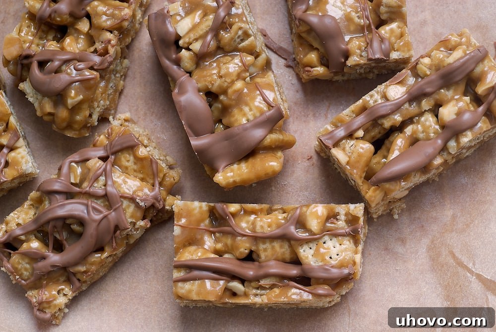 Close-up of a stack of Good Morning Sunshine Bars, highlighting the rich chocolate topping and the wholesome, crunchy base.