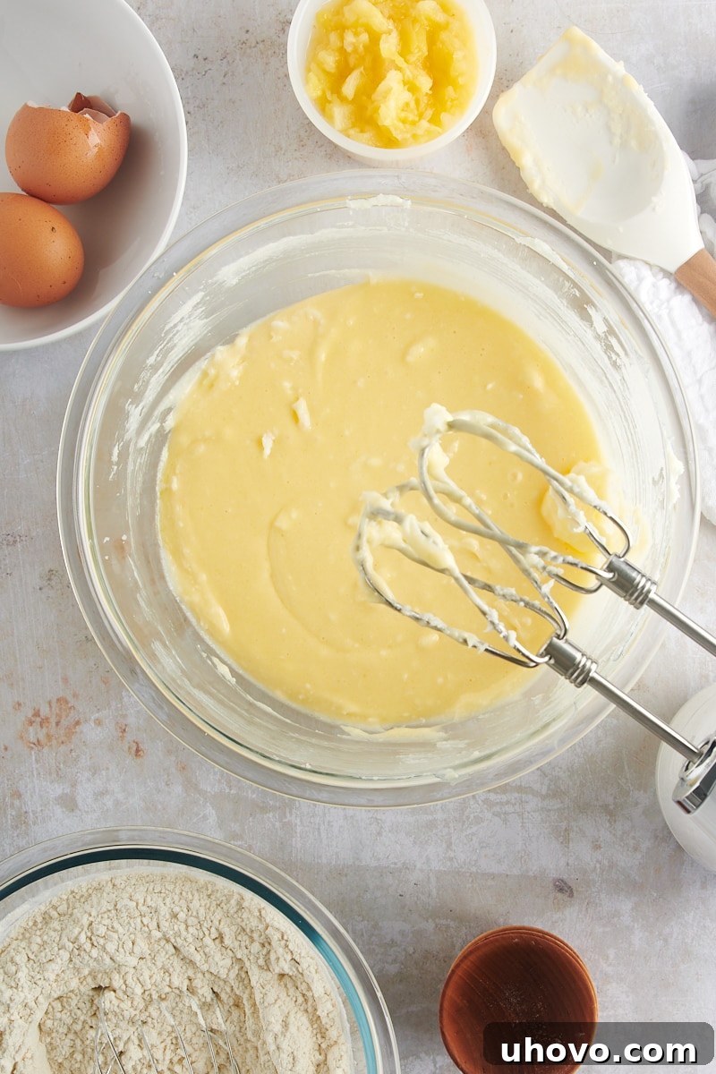 Overhead view of perfectly creamed wet ingredients for Pineapple Cream Cheese Cookies, smooth and light