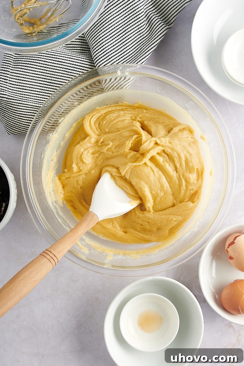 Overhead view of the fully mixed blondie batter, with just a few streaks of flour remaining before folding in the cookies.