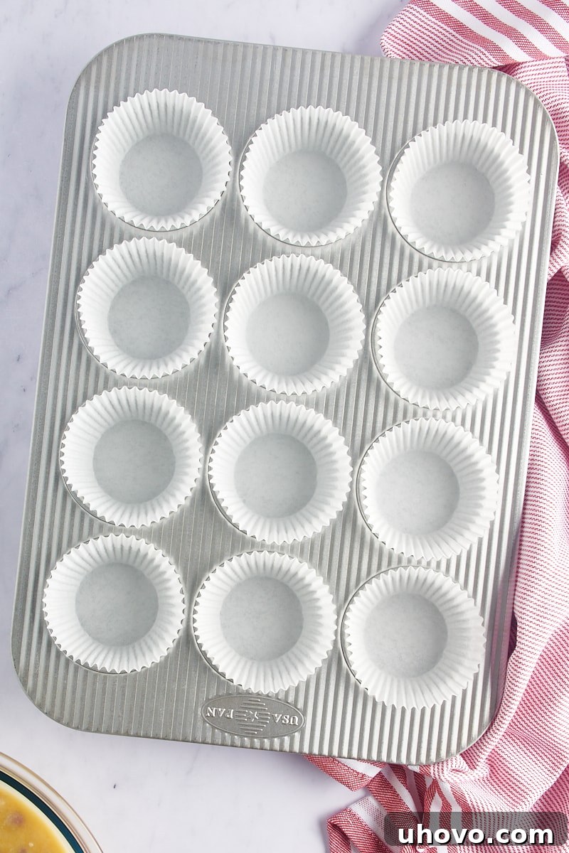 overhead view of a muffin pan with paper liners