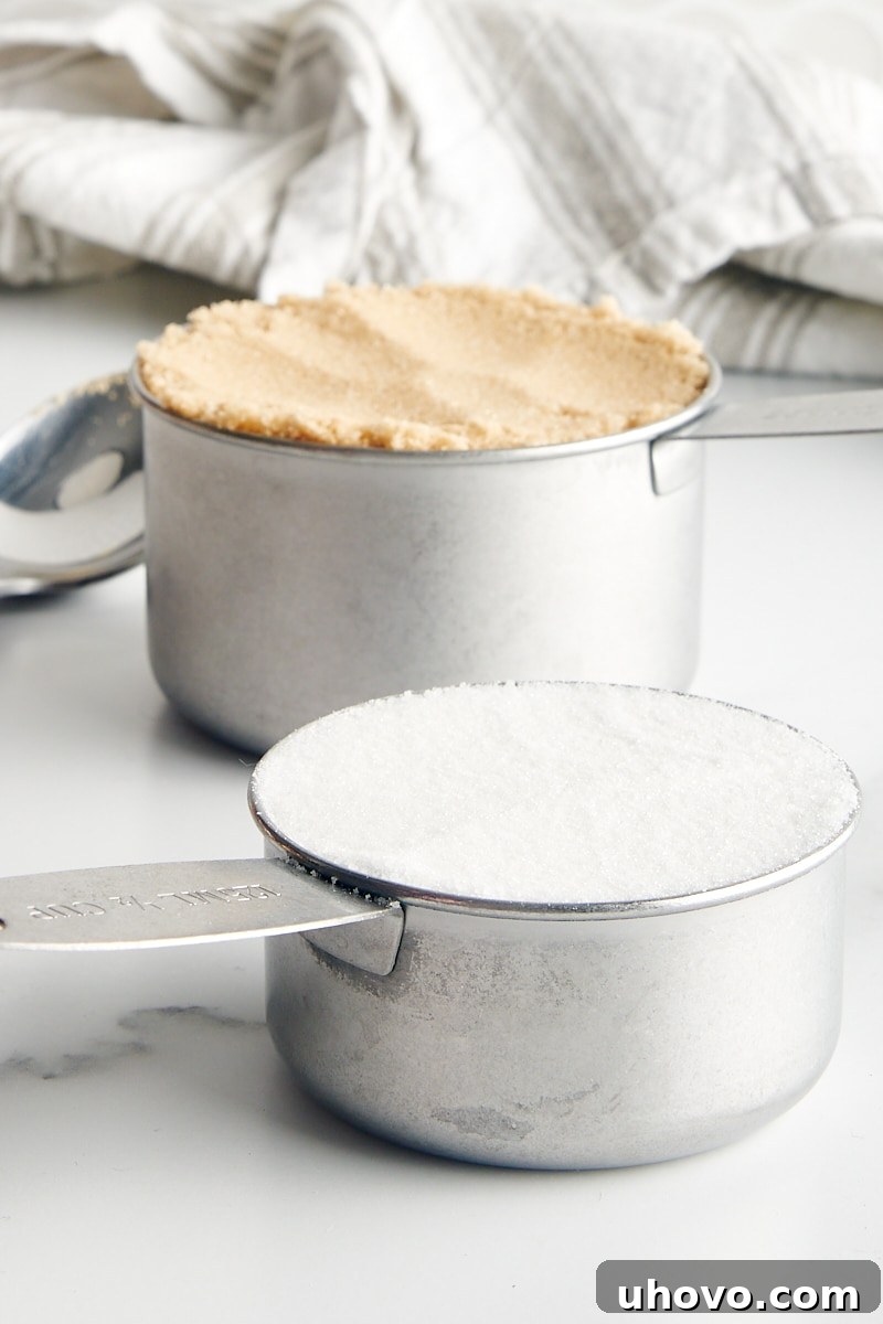 baking ingredients measured in metal measuring cups