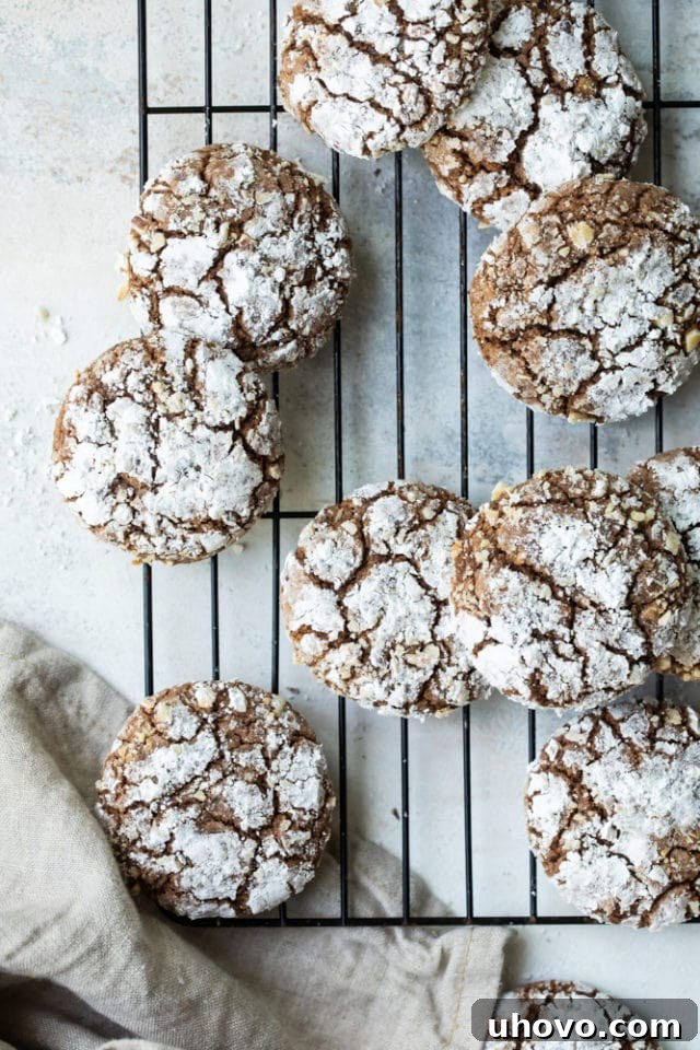Overhead view of hazelnut crinkle cookies on a wire rack.