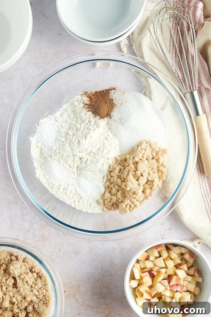 overhead view of dry ingredients for muffins in a glass mixing bowl