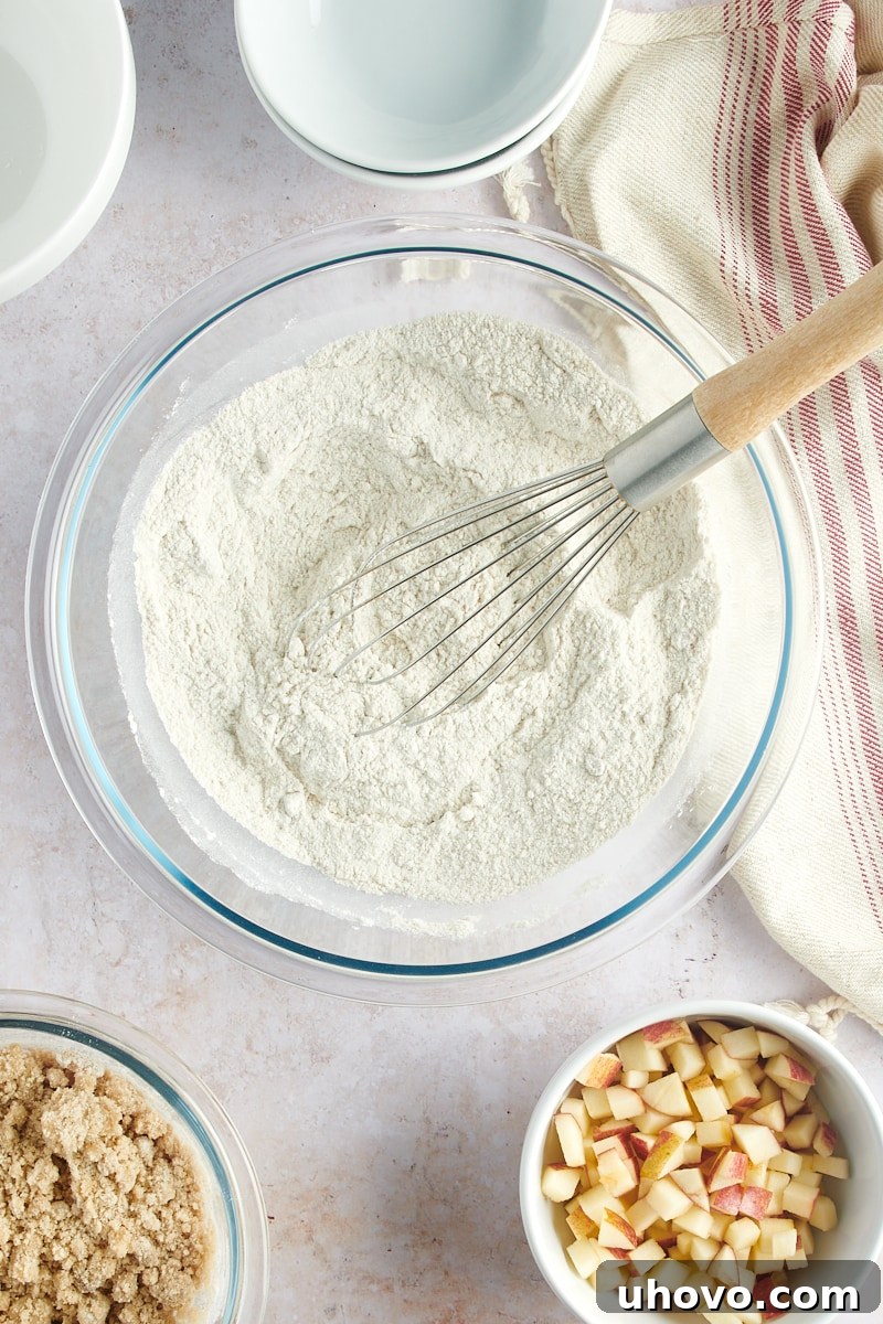 overhead view of mixed dry ingredients for Apple Cinnamon Muffins