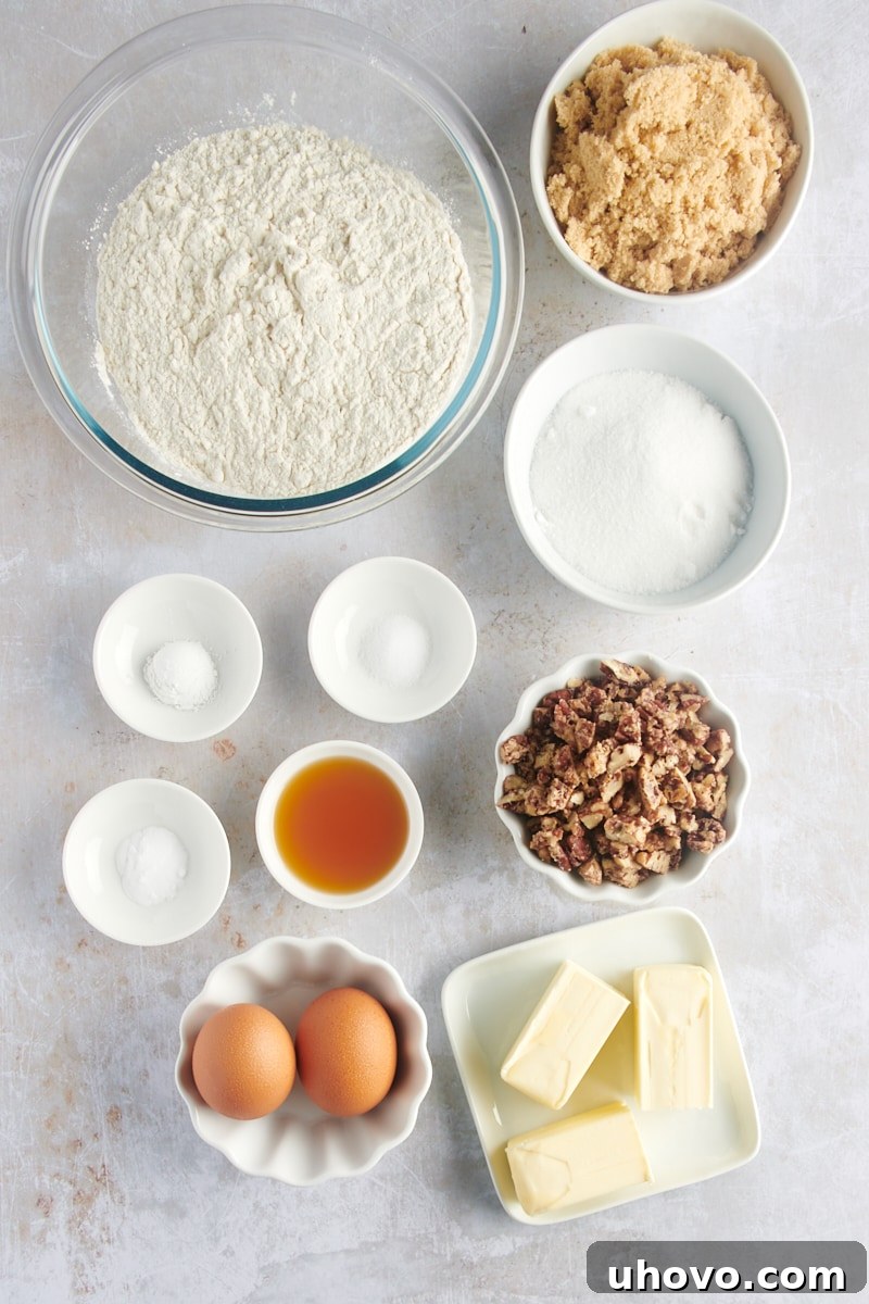 Overhead view of all measured ingredients for Maple Pecan Cookies neatly arranged on a countertop, ready for baking.